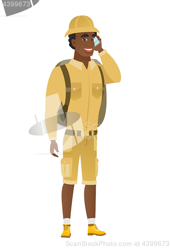 Image of Traveler talking on a mobile phone.