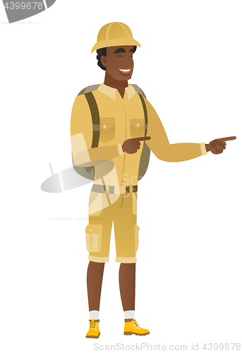 Image of African-american traveler pointing to the side.