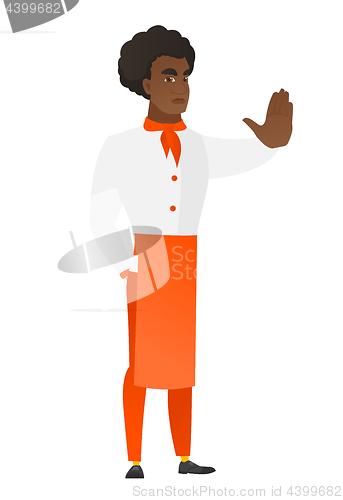 Image of African chef cook showing stop hand gesture.