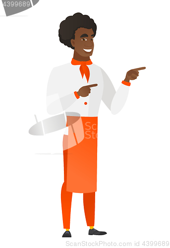 Image of African-american chef cook pointing to the side.