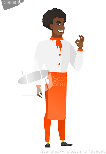 Image of Smiling chef cook showing ok sign.