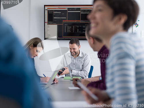 Image of Business Team At A Meeting at modern office building