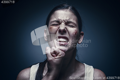 Image of Male fist against kidnapped young woman in the background