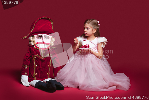 Image of The beauty ballerina standing with nutcracker