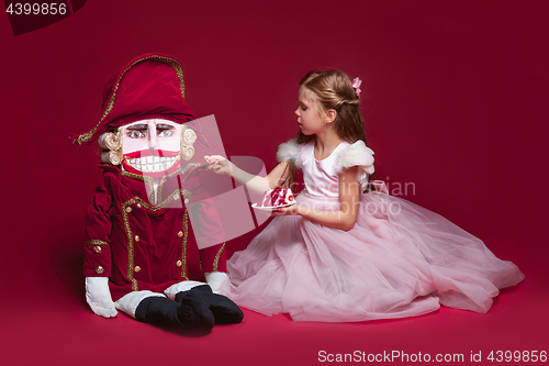 Image of The beauty ballerina standing with nutcracker