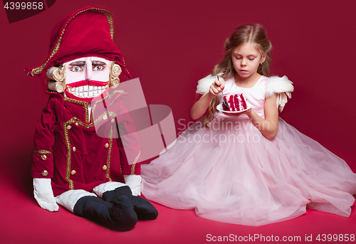 Image of The beauty ballerina standing with nutcracker