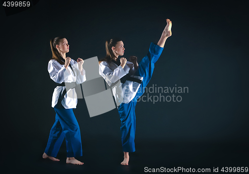 Image of The karate girl with black belt