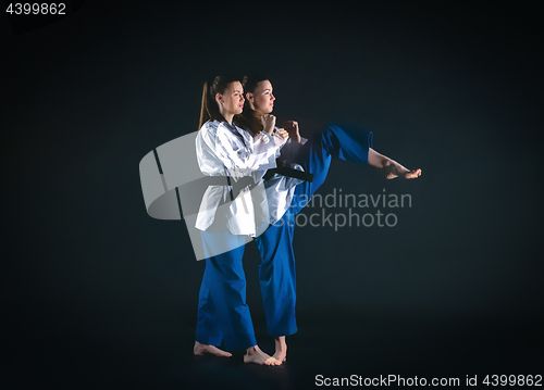 Image of The karate girl with black belt