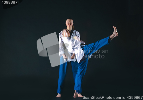 Image of The karate girl with black belt