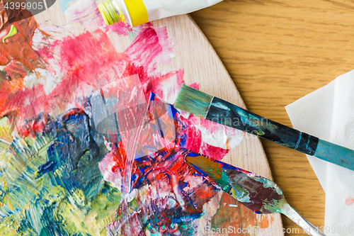 Image of palette knife or painting spatula and paintbrush