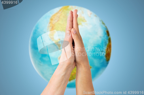 Image of close up of senior and young woman touching hands