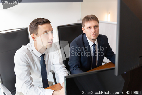 Image of Business team analyzing data at business meeting.