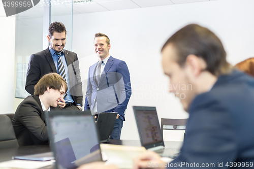 Image of Business people in modern corporate office.