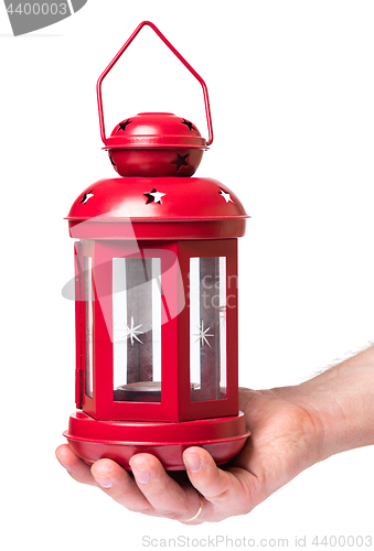 Image of Hand holding red lantern