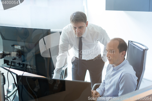 Image of Business team analyzing data at business meeting.