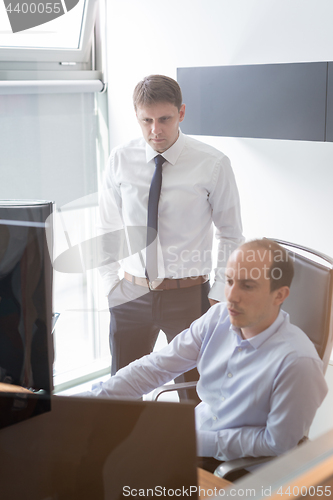 Image of Business team analyzing data at business meeting.