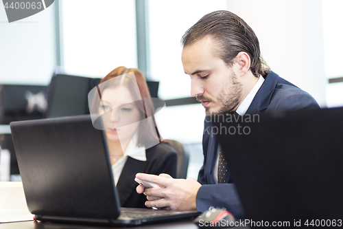 Image of Business people in modern office.