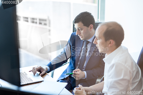 Image of Business team brainstorming and dicussing business ideas at business meeting.