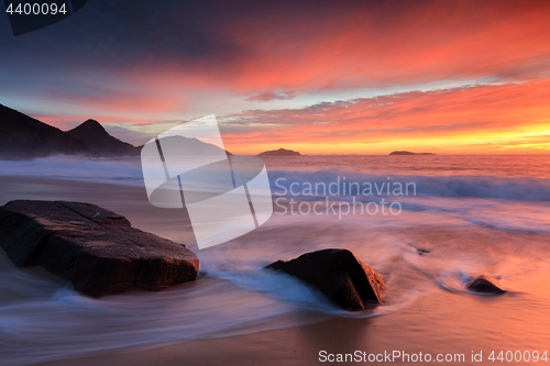 Image of Sunrise flame colours in the sky and water