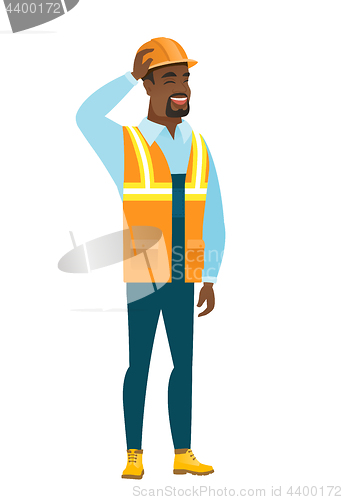 Image of Young african-american builder scratching his head