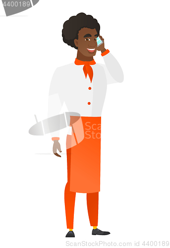 Image of Chef cook talking on a mobile phone.