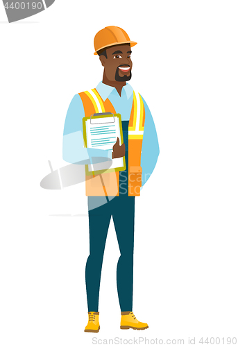 Image of Builder holding clipboard with papers.