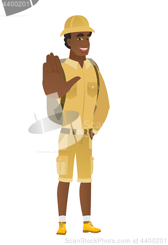 Image of African-american traveler showing palm hand.