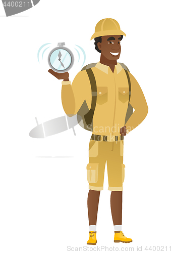 Image of African-american traveler holding alarm clock.