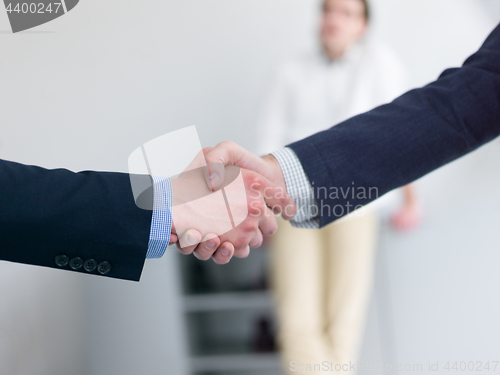 Image of cloasing the deal in modern office interior