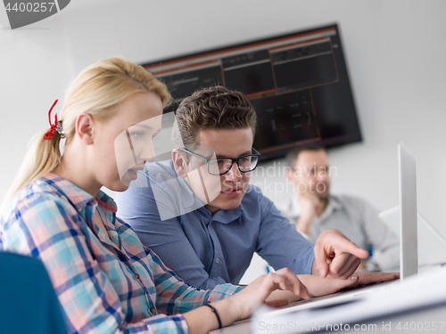 Image of Business Team At A Meeting at modern office building