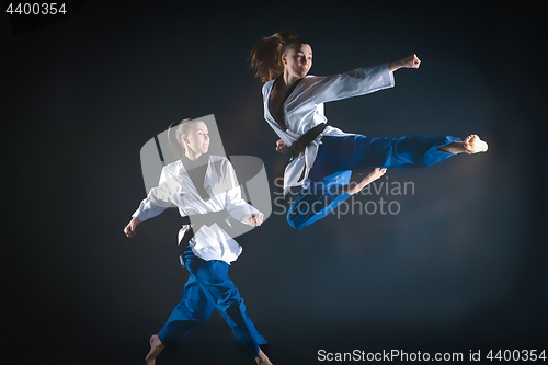 Image of The karate girl with black belt