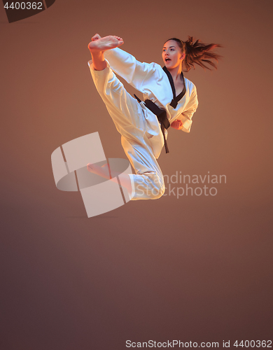 Image of The karate girl with black belt