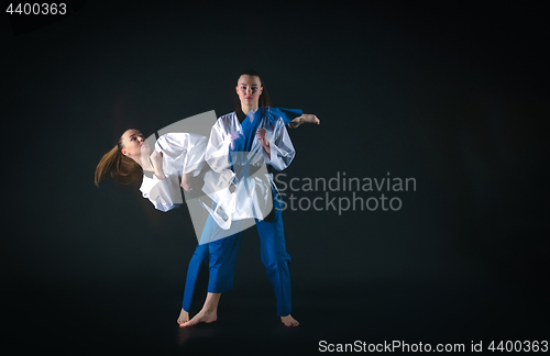 Image of The karate girl with black belt