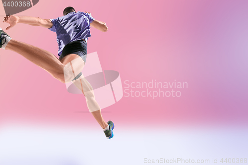 Image of The studio shot of high jump athlete is in action