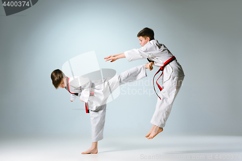 Image of Studio shot of two of kids training karate martial arts