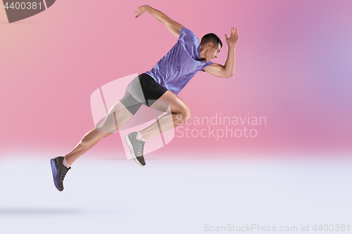 Image of The studio shot of high jump athlete is in action