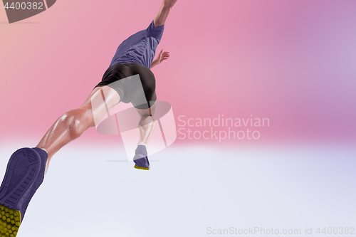 Image of The studio shot of high jump athlete is in action