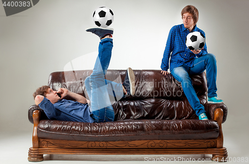 Image of The two guys with balls on gray background