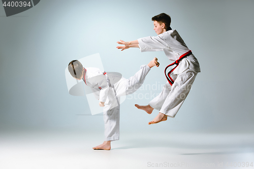 Image of Studio shot of two of kids training karate martial arts