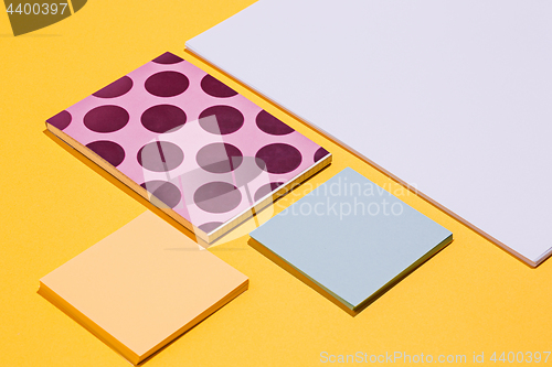 Image of The many notebooks on colored table. memo and planning concept.