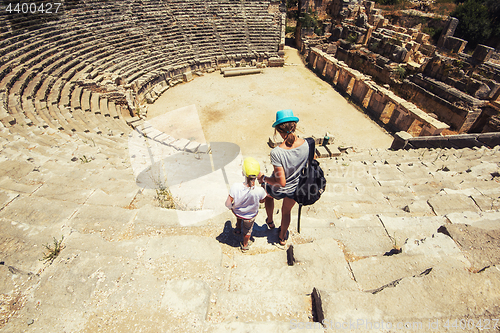 Image of Young woman and her son at theatre