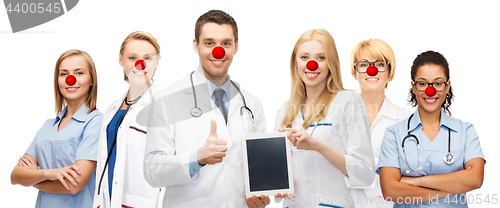 Image of young doctors holding tablet pc in hands