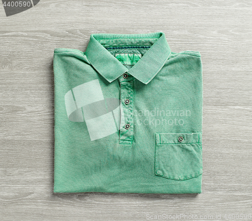 Image of green polo shirt