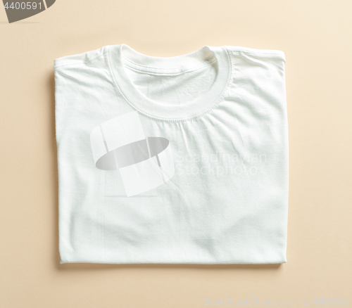 Image of white folded t shirt