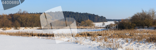 Image of Beautiful winter rural landscape with pond