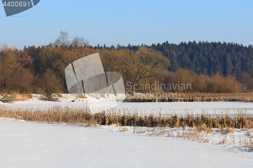 Image of Beautiful winter rural landscape with pond