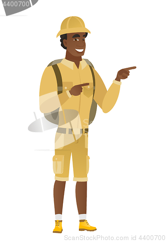 Image of African-american traveler pointing to the side.