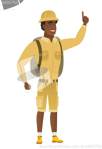 Image of African traveler pointing with his forefinger.