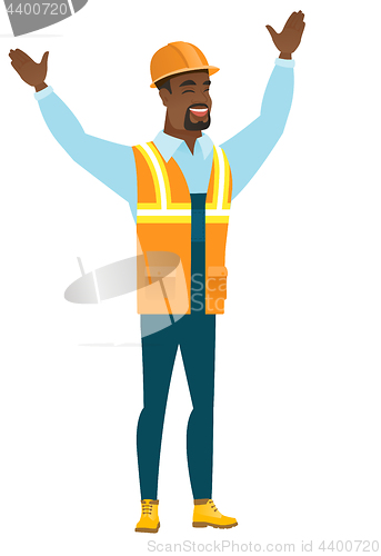 Image of Constructor standing with raised arms up.