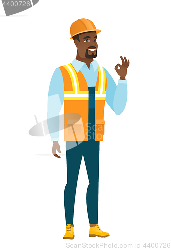 Image of Smiling builder showing ok sign.